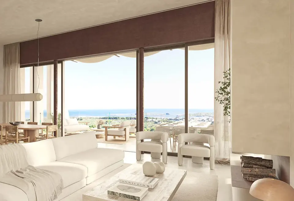 Salón abierto a la terraza con vistas al mar